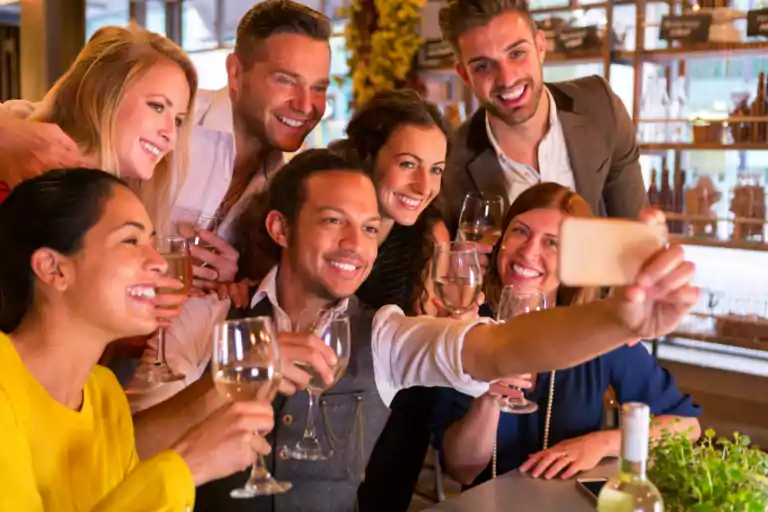 a group of people taking a selfie at the bar in Columbia