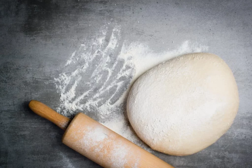 rolling pizza dough